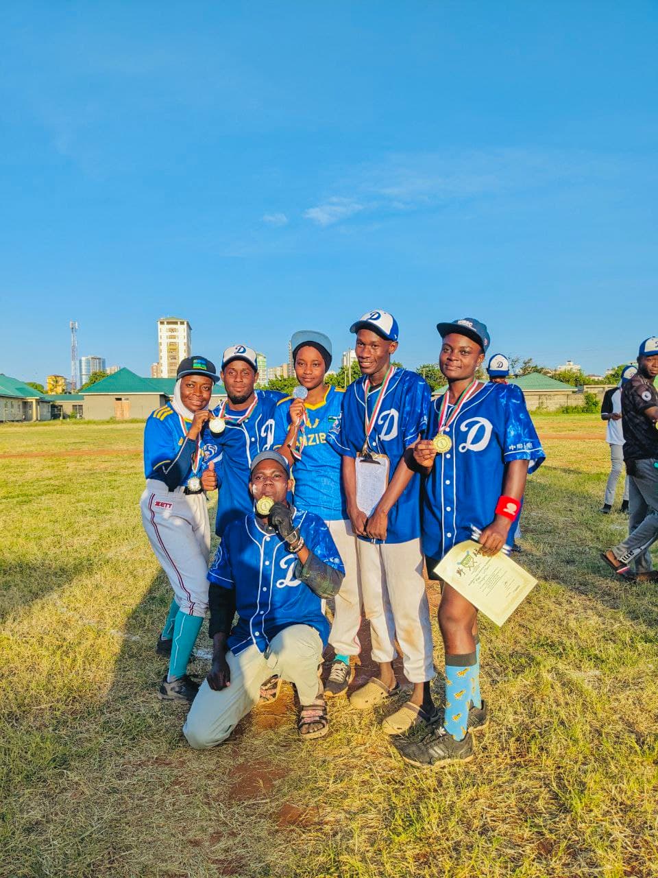 Dragons players displaying medals after a tournament